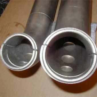 two pipes with multiple corrosion holes