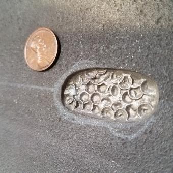 corrosion pattern compared to a penny